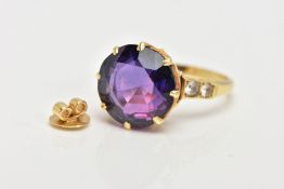 A SYNTHETIC COLOUR CHANGE SAPPHIRE RING, yellow metal ring set with a circular cut colour change