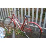 A RED TRIUMPH TRAFFIC MASTER LADIES BICYCLE, 21 inch frame, three speed Sturmey-Archer gears and a