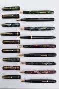 NINE VINTAGE FOUNTAIN PENS BY CONWAY STEWART comprising of a black and gold No15, a black and gold