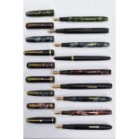 NINE VINTAGE FOUNTAIN PENS BY CONWAY STEWART comprising of a black and gold No15, a black and gold