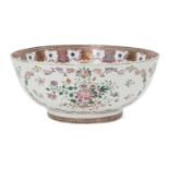 A Chinese export porcelain punch bowl, 18th century, painted in famille rose enamels with