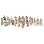 A collection of European ceramic figurines, to include sixteen Meissen and Dresden figurines from