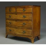 A Regency mahogany bowfront chest of drawers, with two short over three long graduated drawers,