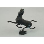 A Chinese bronze figure of a horse, 20th century, modelled rearing, atop a stylized bird form