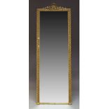 A gilt gesso hall mirror, late 19th, early 20th Century, of rectangular form, the crest with scallop