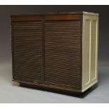 An oak double tambour fronted cabinet, early 20th Century, with white painted panelled sides and