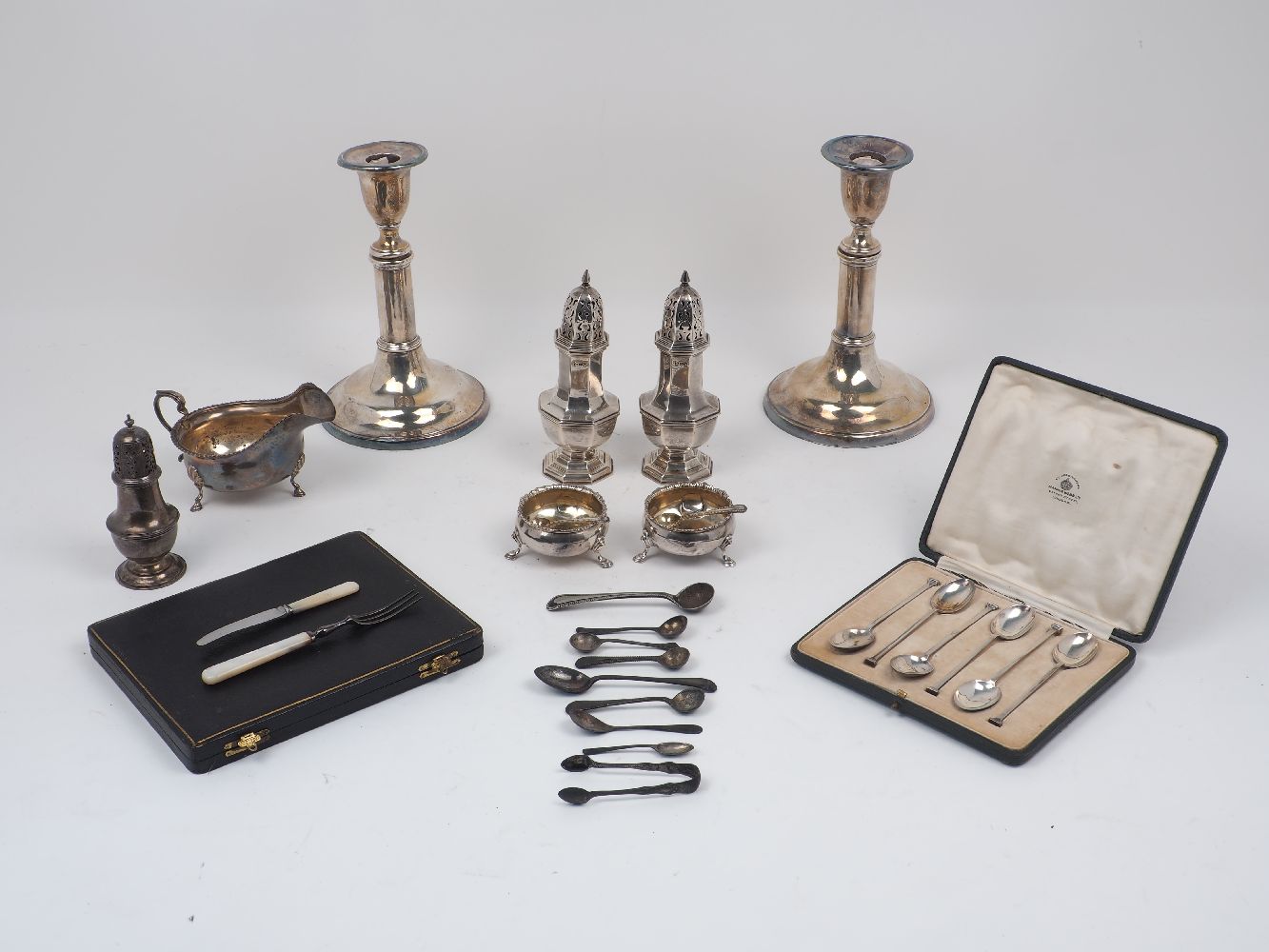 A collection of silver and silver plate items, to include a pair of George IV salt and pepper dishes