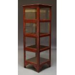 A Chinese red stained vitrine cabinet, late 20th Century, glazed to each side, the front with four