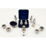A selection of silver cruets comprising: a George III silver cruet dish with gadroon edge, London,