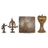 A brass cobra-head lingham, a small bronze figure of Krishna dancing, a bronze tantric plaque and