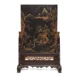 A Chinese lacquer table screen, late Qing dynasty, painted with a mountainous landscape, 58cm x