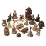 A group of Buddhist and Hindu figurines in bronze, wood and other metals, including a larger wood