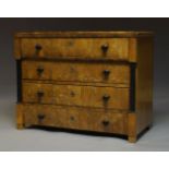 A Biedermeier walnut and ebonised secretaire chest, 19th Century, the top secretaire drawer