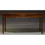 A mahogany serving table in the Georgian taste, second half 20th Century, the bowfront top above
