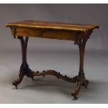 A William IV rosewood side table, the rectangular top with shaped serpentine ends, above single