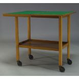 A walnut 'Chevin' trolley card table, mid 20th Century, with fold over top enclosing green baize