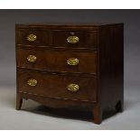 A Regency mahogany bow front chest of drawers, with two short over two long drawers, above shaped