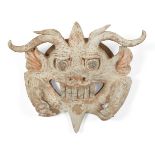 A Chinese terracotta mask with the face of a threatening beast, Tang dynasty, the horned beast