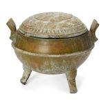 A Chinese pottery green-glazed ritual tripod food vessel, ding, Han dynasty, the domed cover moulded