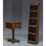 A Regency mahogany drop leaf side table, with two opposing drawers and two opposing faux drawers, on