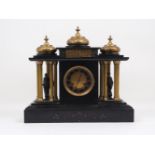 A French gilt metal and slate mantle clock, 19th century, of architectural form with three ogee form