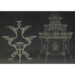 A white-painted cast-iron jardinière stand, second half 20th Century, of scrolled openwork form with