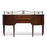 A Regency style mahogany and crossbanded sideboard, early 20th Century, the top with brass gallery