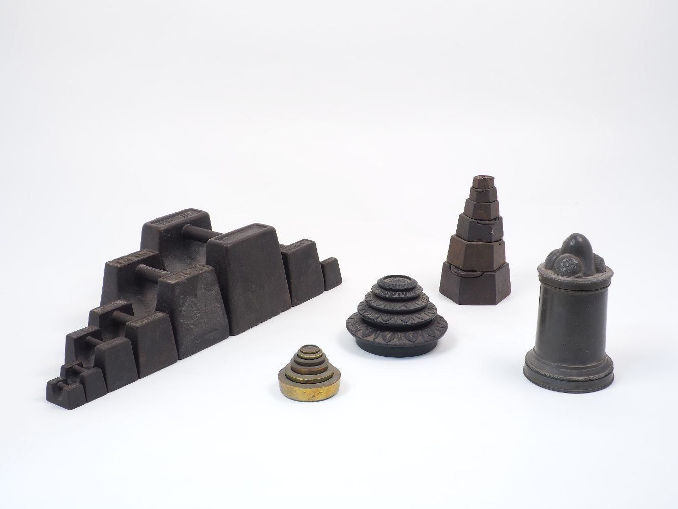 A collection of various groups of metal weights, to include eight of brick form, stamped V & T Avery