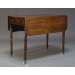 A George IV mahogany and line inlaid Pembroke table, with one frieze drawer and opposing faux