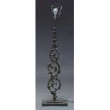A Victorian cast iron scrolling foliate section of railing, later mounted and converted to a lamp,