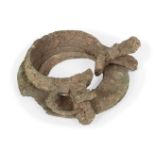 Two Chinese bronze bracelets, Neolithic period, now fused as one, 9cm diameterTwo Chinese bronze