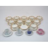 A group of ten George Jones & Sons twin handled pudding cups, with thirteen saucers, 19th Century,