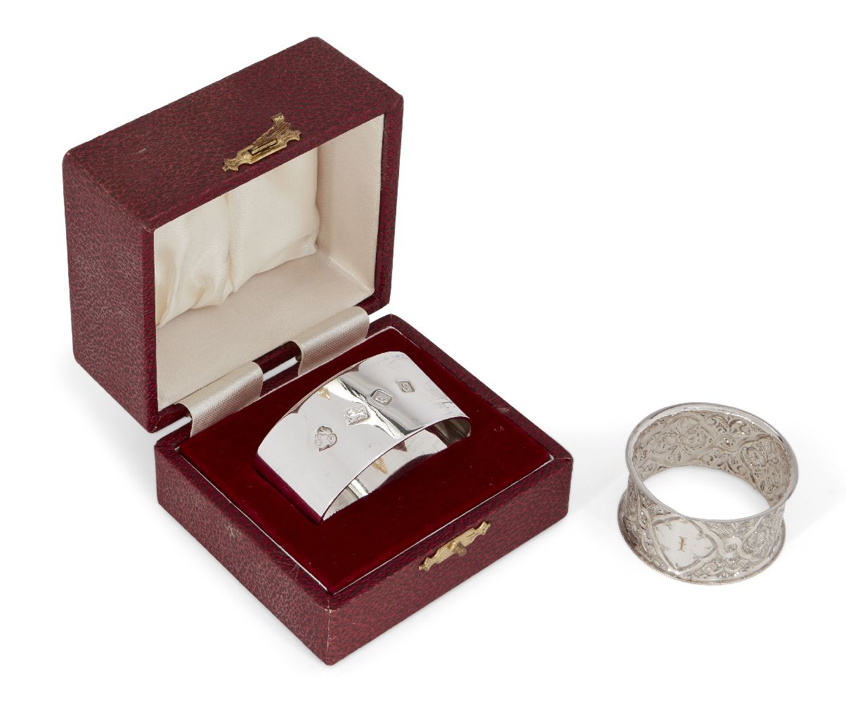 A silver napkin ring in fitted case, London, c.1973, CJ Vander Ltd., of plain flattened oval form,