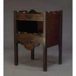 A George III mahogany tray top commode, the shaped gallery top with pierced grips, above single