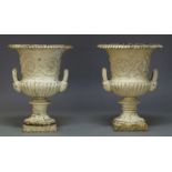 A pair of Victorian cast iron and white painted Campana urns, each with gadrooned flared rim with