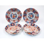 Four Japanese porcelain imari chargers, late 19th century, painted in the imari palette with