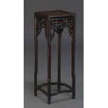 A Chinese hardwood jardiniere stand, 20th Century, the square rounded top, above pierced frieze on