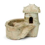 A Chinese pottery model of a pig sty latrine, Han dynasty, the raised square hut with ridged sloping