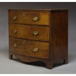 A Regency mahogany chest, with three long graduated drawers, raised on splayed bracket feet, 85cm