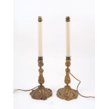 A pair of ormolu candlestick lamps, late 19th century, of inverse baluster form, the spreading