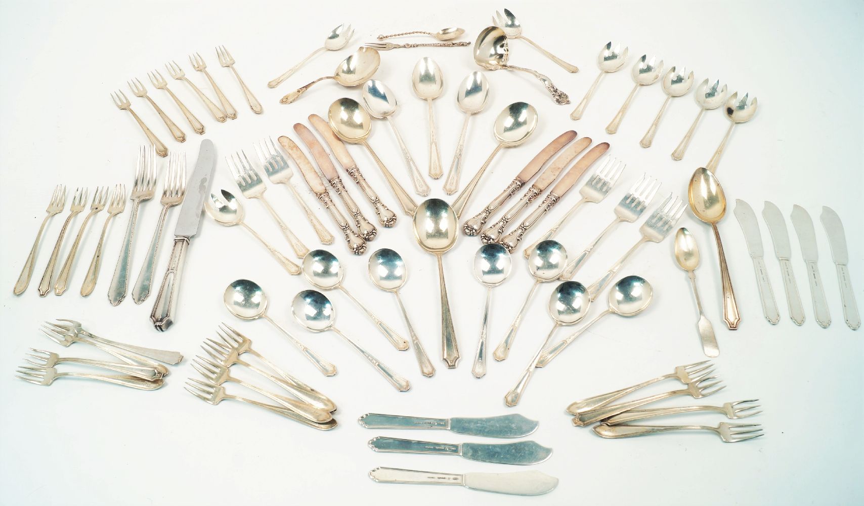 A quantity of American silver flatware including: a set of seven butter knives stamped Lunt