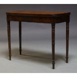 A Regency mahogany and crossbanded card table, the fold over top enclosing green baize lined playing