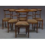 A set of six Regency rosewood bar back dining chairs, with curved bar backs above drop in velvet