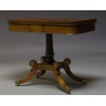 A Regency rosewood and brass inlaid card table, the fold over top enclosing green baize lined