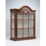 A Dutch taste wall mounted display cabinet, 20th century, with domed top and canted corners, with