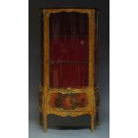 A French kingwood and ormolu mounted serpentine vitrine, 19th Century, with single glazed door