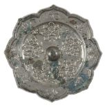 A Chinese silvered bronze octafoil mirror of lighua type, Tang dynasty, finely cast with five floral