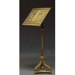 A grey painted and parcel gilt music stand, 19th Century, the rectangular stand decorated with lyre,