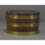 A George III mahogany and brass bound wine cooler, of tapered cylindrical form, with later lead