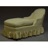 An Edwardian chaise lounge, with curved back and down swept armrests, with yellow upholstered slip